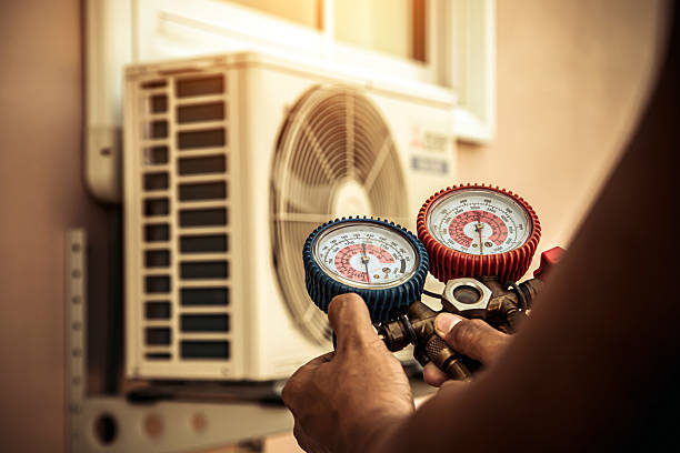 Professional Air Conditioning Service technician working in Grant, MN
